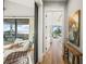 Bright hallway with barn door entry to bedroom and water views at 1707 Palma Sola Blvd, Bradenton, FL 34209