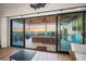 View of balcony from inside through sliding doors at 1707 Palma Sola Blvd, Bradenton, FL 34209