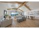 Open living space with hardwood floors, vaulted ceilings, and water views at 1707 Palma Sola Blvd, Bradenton, FL 34209