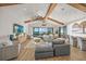 Bright living room, hardwood floors, vaulted ceilings, and water views at 1707 Palma Sola Blvd, Bradenton, FL 34209