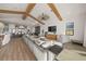 Open concept living room with hardwood floors and kitchen view at 1707 Palma Sola Blvd, Bradenton, FL 34209