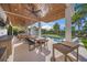 Outdoor kitchen and dining area adjacent to the refreshing pool at 1707 Palma Sola Blvd, Bradenton, FL 34209