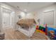 Playroom with a unique thatched bed, toys, and a TV at 1707 Palma Sola Blvd, Bradenton, FL 34209