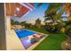 Relaxing pool area with lounge chairs and lush landscaping at 1707 Palma Sola Blvd, Bradenton, FL 34209