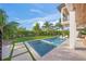 Relaxing poolside retreat with spacious patio and lush landscaping at 1707 Palma Sola Blvd, Bradenton, FL 34209