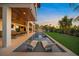 Tranquil evening view of the pool and patio area at 1707 Palma Sola Blvd, Bradenton, FL 34209