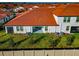 Aerial view of the home's backyard, showcasing grass and AC units at 17322 Holly Well Ave, Wimauma, FL 33598