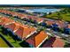 Aerial view of new homes near commercial greenhouses at 17322 Holly Well Ave, Wimauma, FL 33598