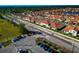 Aerial view of new homes with tile roofs in a new community at 17322 Holly Well Ave, Wimauma, FL 33598