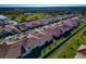 Aerial view of new homes with tile roofs in a new community at 17322 Holly Well Ave, Wimauma, FL 33598