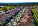 Aerial view of new homes with tile roofs in a new community at 17322 Holly Well Ave, Wimauma, FL 33598