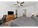 Large bedroom with king bed, dresser, and access to bathroom at 17322 Holly Well Ave, Wimauma, FL 33598