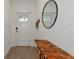 Inviting entryway with wood-look floors and a modern console table at 17322 Holly Well Ave, Wimauma, FL 33598