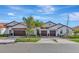 Three-unit building with attached garages and landscaping at 17322 Holly Well Ave, Wimauma, FL 33598