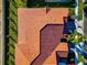 Aerial view of a house with a clay tile roof at 17322 Holly Well Ave, Wimauma, FL 33598