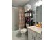 Clean bathroom with shower/tub combo and updated shelving at 2220 Stickney Point Rd # 537, Sarasota, FL 34231