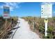 Beach access path with sea turtle nesting signs at 2220 Stickney Point Rd # 537, Sarasota, FL 34231