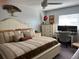 Spacious Primary bedroom with king-size bed and built-in workspace at 2220 Stickney Point Rd # 537, Sarasota, FL 34231