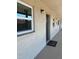 Exterior view of condo building, showing hallway and doors at 2220 Stickney Point Rd # 537, Sarasota, FL 34231
