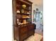 Tall wooden cabinet with multiple shelves and drawers at 2220 Stickney Point Rd # 537, Sarasota, FL 34231