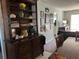 Bright dining area features a wood table with chairs and a large hutch at 2220 Stickney Point Rd # 537, Sarasota, FL 34231
