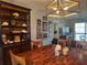 Dining area with wood table, chairs, and built-in hutch at 2220 Stickney Point Rd # 537, Sarasota, FL 34231