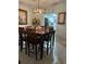 Dining room with a large wooden table and six chairs at 2220 Stickney Point Rd # 537, Sarasota, FL 34231