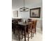 Spacious dining area with large wooden table and six chairs at 2220 Stickney Point Rd # 537, Sarasota, FL 34231