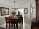 Dining room with view into kitchen and large wooden table at 2220 Stickney Point Rd # 537, Sarasota, FL 34231