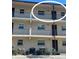 Exterior view of condo building showcasing balcony and parking at 2220 Stickney Point Rd # 537, Sarasota, FL 34231