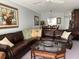 Living room with leather sectional sofa and wood coffee table at 2220 Stickney Point Rd # 537, Sarasota, FL 34231