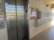 Condo building entryway with elevator and mailboxes at 2220 Stickney Point Rd # 537, Sarasota, FL 34231