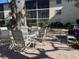 Outdoor patio furniture with a table and chairs at 2220 Stickney Point Rd # 537, Sarasota, FL 34231