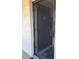 Black screen door leading to condo entrance at 2220 Stickney Point Rd # 537, Sarasota, FL 34231
