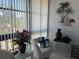 Relaxing sunroom with window seating and tropical decor at 2220 Stickney Point Rd # 537, Sarasota, FL 34231