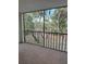 Screened balcony overlooking lush landscape at 2753 Orchid Oaks Dr # 104, Sarasota, FL 34239