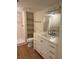 Bathroom features a vanity with white cabinets and a shower at 2753 Orchid Oaks Dr # 104, Sarasota, FL 34239