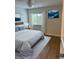 Serene bedroom featuring wood floors and a calming atmosphere at 2753 Orchid Oaks Dr # 104, Sarasota, FL 34239