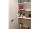 Well-organized laundry closet with shelving at 2753 Orchid Oaks Dr # 104, Sarasota, FL 34239