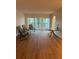 Living area with hardwood floors and view at 2753 Orchid Oaks Dr # 104, Sarasota, FL 34239