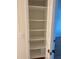 White pantry with adjustable shelves offers extra storage at 2753 Orchid Oaks Dr # 104, Sarasota, FL 34239