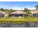 Aerial view of home and lake at 288 Fairway Isles Ln, Bradenton, FL 34212