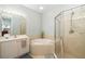 Bathroom with soaking tub, shower, and updated vanity at 288 Fairway Isles Ln, Bradenton, FL 34212