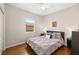 Guest bedroom with hardwood floors and ceiling fan at 288 Fairway Isles Ln, Bradenton, FL 34212