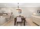 Bright dining area with a table and chairs, adjacent to a kitchen at 288 Fairway Isles Ln, Bradenton, FL 34212