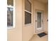 Front door entry with sidelights and storm door at 288 Fairway Isles Ln, Bradenton, FL 34212