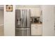Stainless steel refrigerator in a kitchen with white cabinets at 288 Fairway Isles Ln, Bradenton, FL 34212