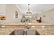 Kitchen sink and granite countertop with a view into the living room at 288 Fairway Isles Ln, Bradenton, FL 34212