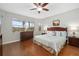 Spacious main bedroom with wood floors and lake views at 288 Fairway Isles Ln, Bradenton, FL 34212