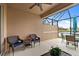 Outdoor patio with seating and lake view at 288 Fairway Isles Ln, Bradenton, FL 34212